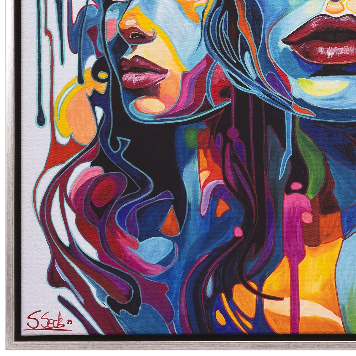 Das Bild zeigt ein abstraktes, farbenintensives Porträt zweier Frauenköpfe, die sich überlagern. Die leuchtenden Farbfelder in Blau, Rot, Gelb, Orange und Violett fließen ineinander über, erzeugen eine dynamische Wirkung und emotionale Tiefe. Der Eindruck wird durch den weißen Hintergrund und einen Holzrahmen verstärkt.