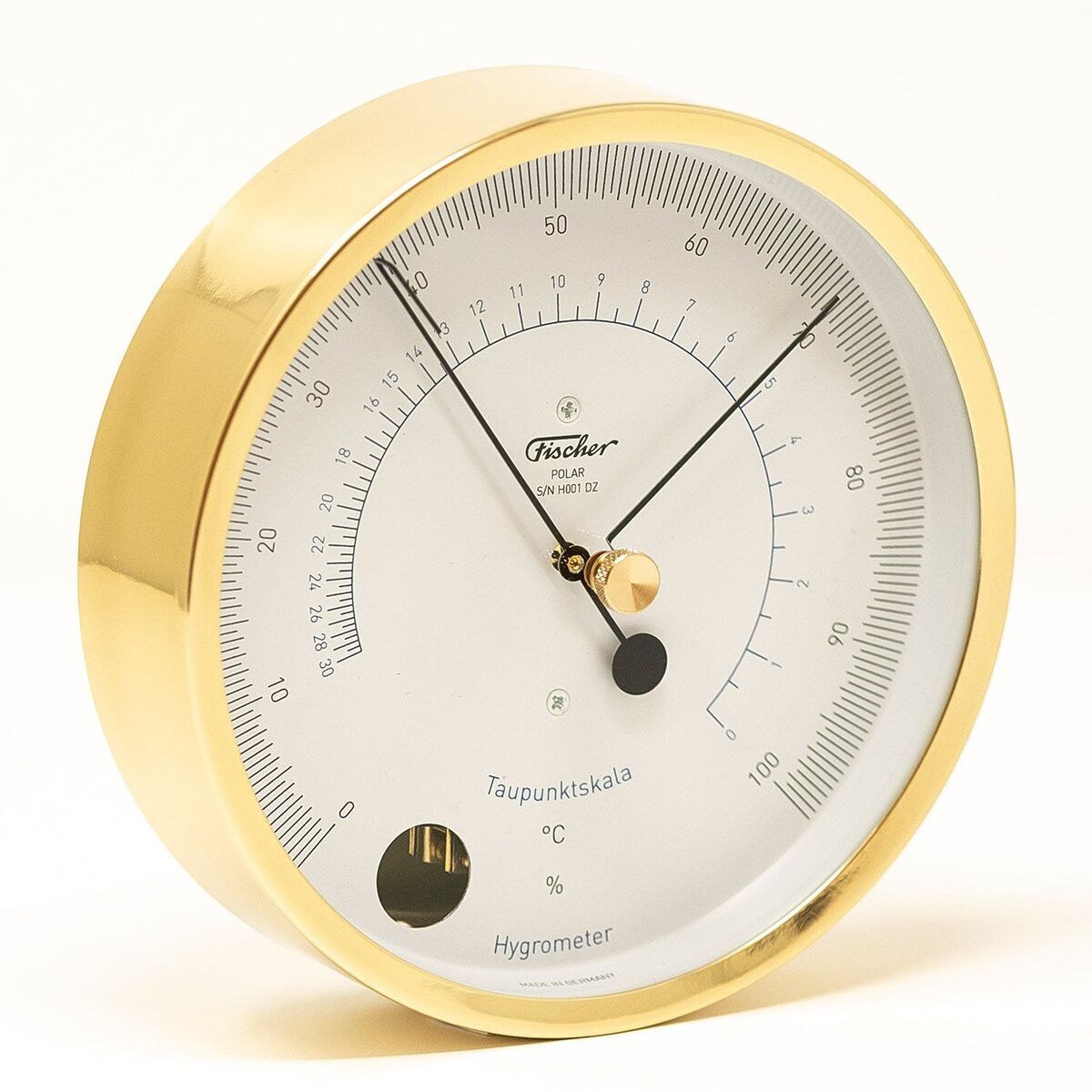 Foto eines goldfarbenen Hygrometers der ZEIT-Sonderedition »POLAR« im Set. Das runde, analoge Gerät misst präzise Temperatur und Luftfeuchtigkeit und zeigt eine hohe Verarbeitungsqualität.