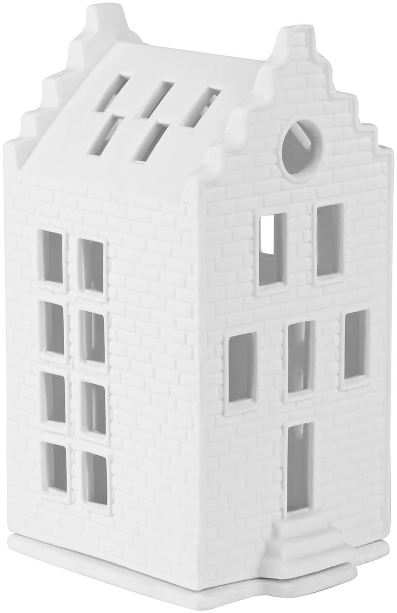 Das Bild zeigt ein kleines, detailreiches Lichthaus aus weißer Keramik in der Form eines Backsteinhauses mit mehreren Fenstern und Ziegelstruktur. Das Lichthaus dient als Teelichthalter für stimmungsvolle Wohnraumdekoration, insbesondere in der Advents- und Weihnachtszeit.