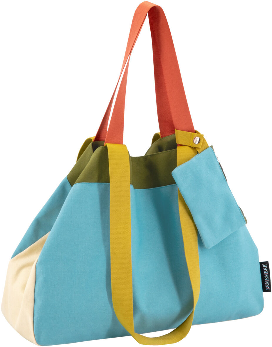 Eine bunte Canvas-Tasche mit roten, gelben, blauen und grünen Tönen, ausgestattet mit langen Tragegriffen. Die Tasche wirkt geräumig und ist aus umweltfreundlichem Material gefertigt.