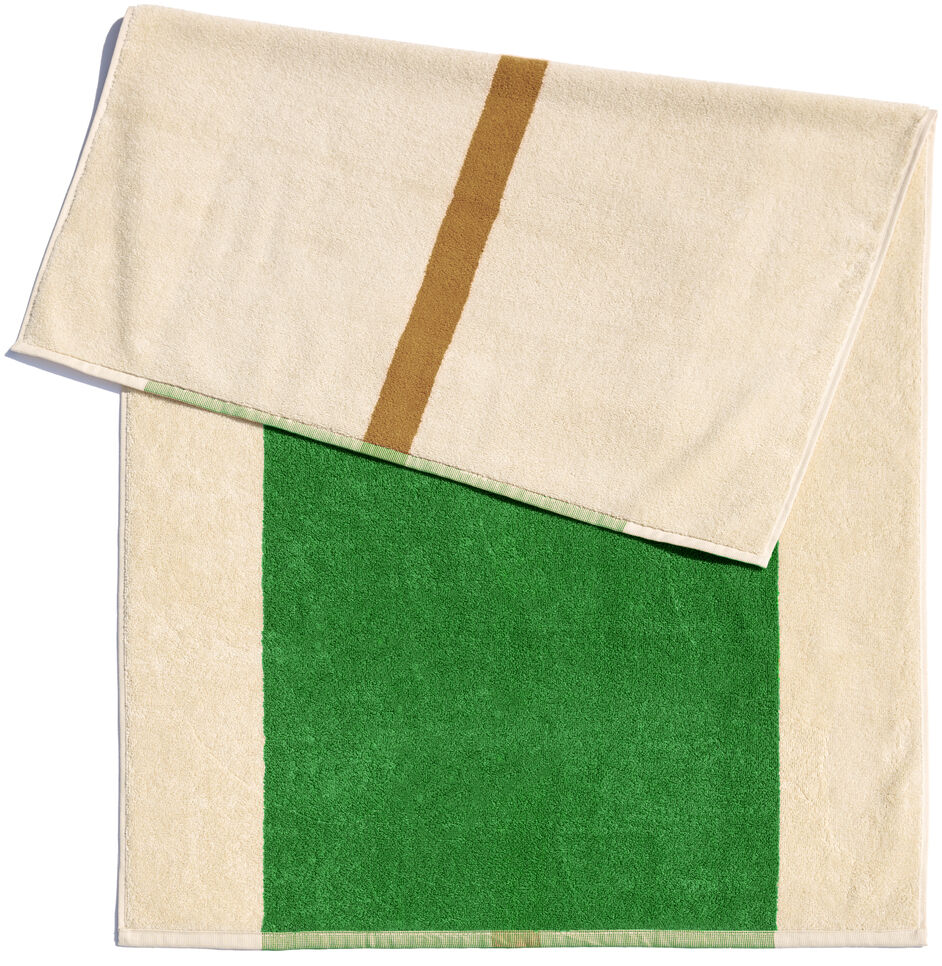 Badematte, 50 x 80 cm, aus Baumwolle. Die Matte ist größtenteils beige mit einem großen grünen Abschnitt und einem braunen Streifen.
