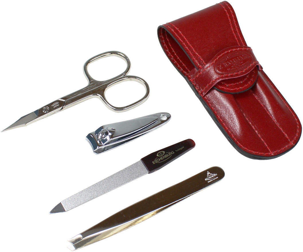 Ein Maniküreset mit einem roten Kalblederetui. Das Set enthält eine Nagelschere, einen Nagelknipser, eine Nagelfeile und eine Pinzette, alle aus Metall.