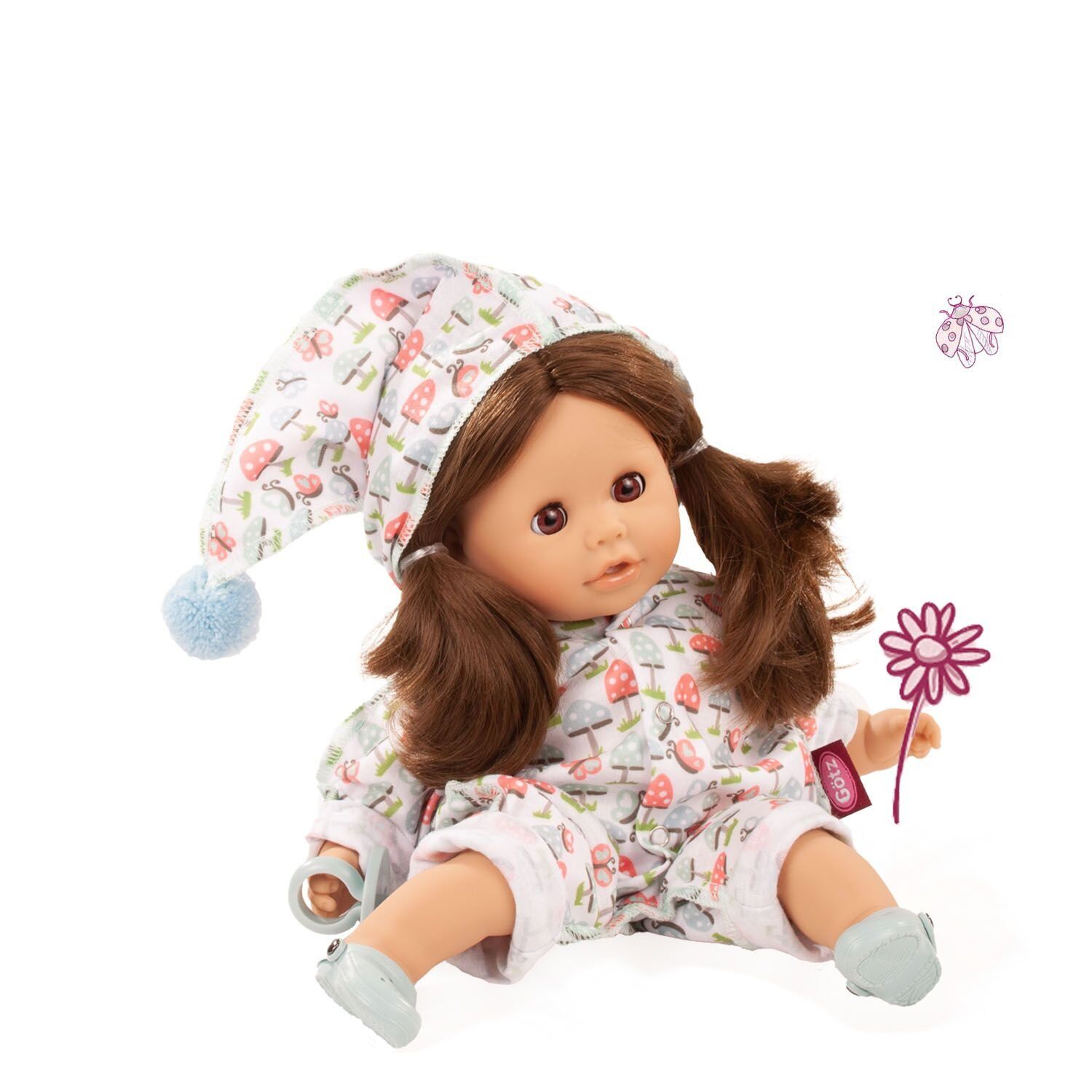 Badepuppe »Cosy Aquini Glückspilz« sitzt mit braunen Zöpfen im bunten Schlafanzug mit Pilzmuster und passender Mütze, ideal für Kinder zum Spielen und Baden geeignet.