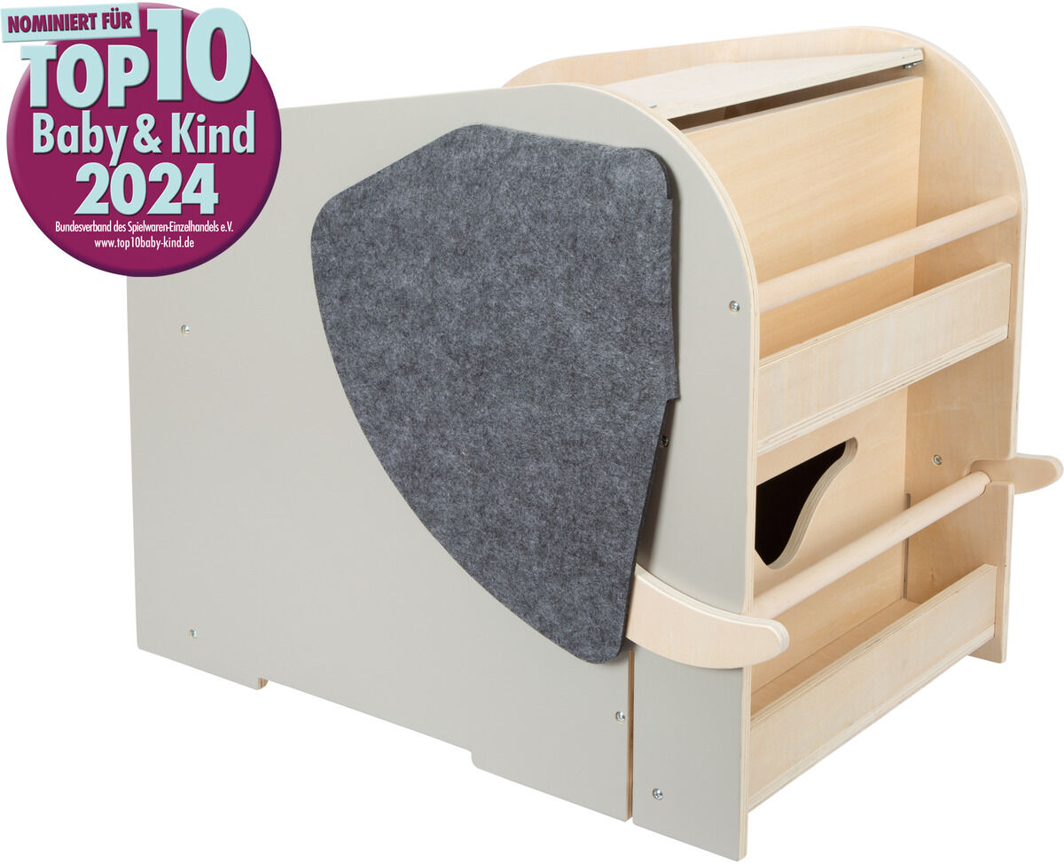 Spielzeugbox in Form eines Elefanten mit Sitzfunktion und Rollen, aus Holz mit grauem Filzdetail, ideal für Kinderzimmer zur Aufbewahrung von Spielzeug, nominiert für einen Top-Preis im Jahr 2024.