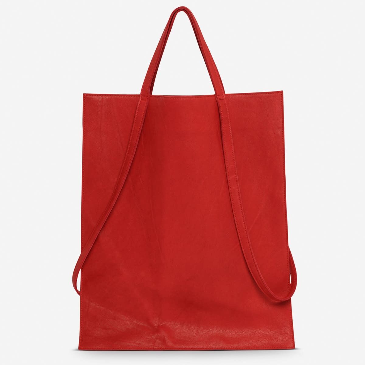 Rote Shopper-Tasche aus Leder mit zwei langen Griffen, minimalistisches und stilvolles Design.