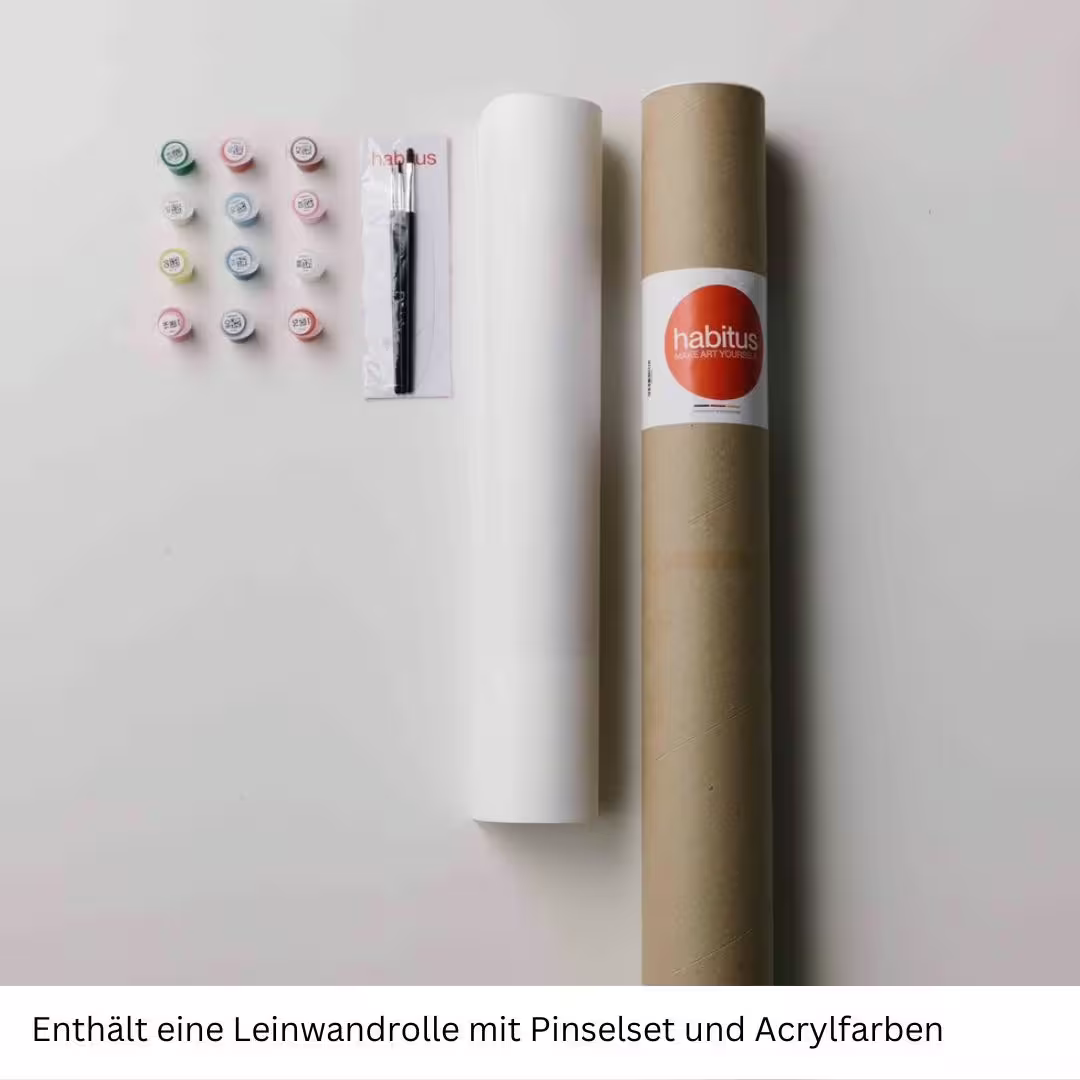 alt="Bastelset aufgereiht auf Tisch bestehend aus Farben, Pinsel und einer Papierrolle"