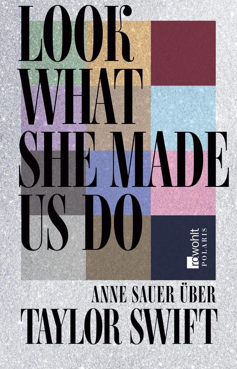 Buchcover von 'Look What She Made Us Do' von Anne Sauer über Taylor Swift. Der Titel ist in einer großen, farbigen Schrift auf einem gemusterten Hintergrund dargestellt. Mehrere Farbblöcke in Grün, Lila, Blau, Braun, Dunkelblau und Grau sind abgebildet.