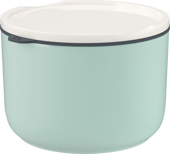 Ein hellgrüner Lunchbox-Behälter mit weißem Deckel und schwarzem Verschlussrand, geeignet für die Aufbewahrung und den Transport von Mahlzeiten.