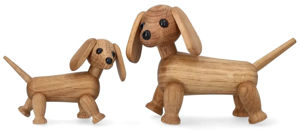 Zwei detailreiche Holzfiguren eines Dackels in unterschiedlichen Größen stehen nebeneinander auf weißem Hintergrund. Beide sind aus hellem Holz gefertigt, haben bewegliche Köpfe, schwarze Knopfaugen und betonte lange Ohren sowie klare, glatte Oberflächen.
