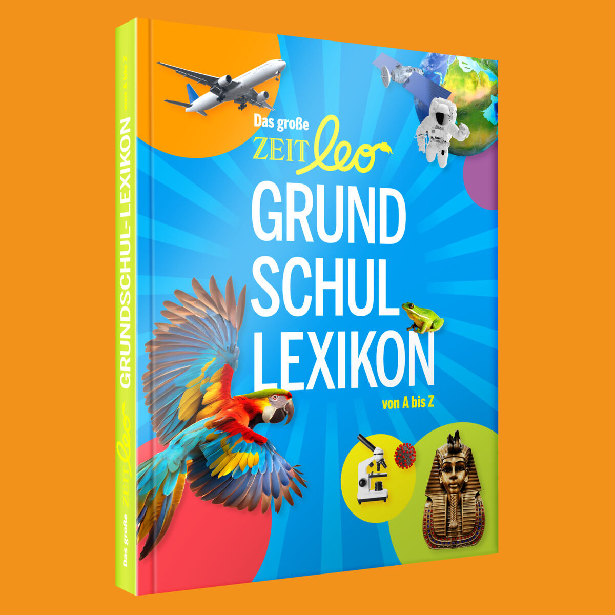 Das große ZEIT-LEO Grundschullexikon von A-Z zeigt ein farbenfrohes Buchcover mit verschiedenen Abbildungen wie einem Papagei, einem Flugzeug, einer Weltraumrakete und einer ägyptischen Maske. Das Cover hat einen blauen Hintergrund mit bunten Kreisen. Der Buchrücken ist gelb mit dem Buchtitel entlang der Kante.