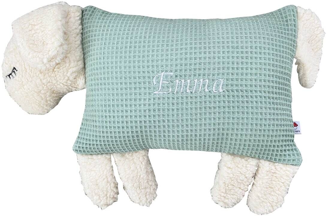 Ein Kuscheltierkissen in Form eines Schafs mit weißem Plüsch und hellgrünem Stoff mit dem Namen Emma darauf.