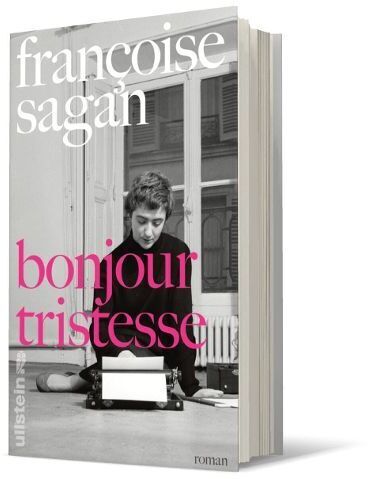 Buchcover von Françoise Sagan: Bonjour Tristesse, zeigt eine junge Frau an einer Schreibmaschine in Schwarzweiß, mit dem Buchtitel in pinken Buchstaben.