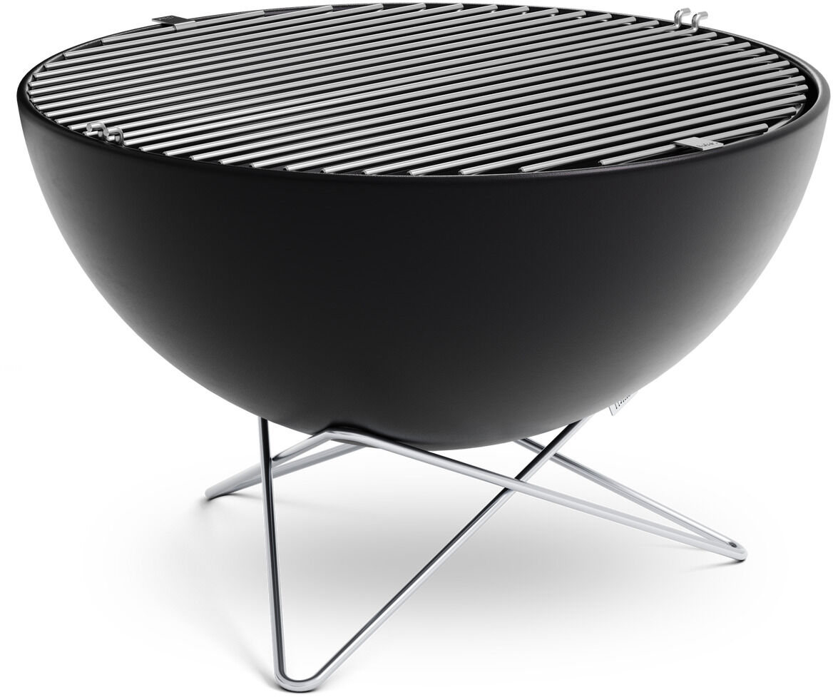 Ein runder Grillrost aus Edelstahl auf einer modernen, minimalistisch gestalteten Feuerschale. Das Design ist elegant und funktional, perfekt für den Einsatz im Freien.