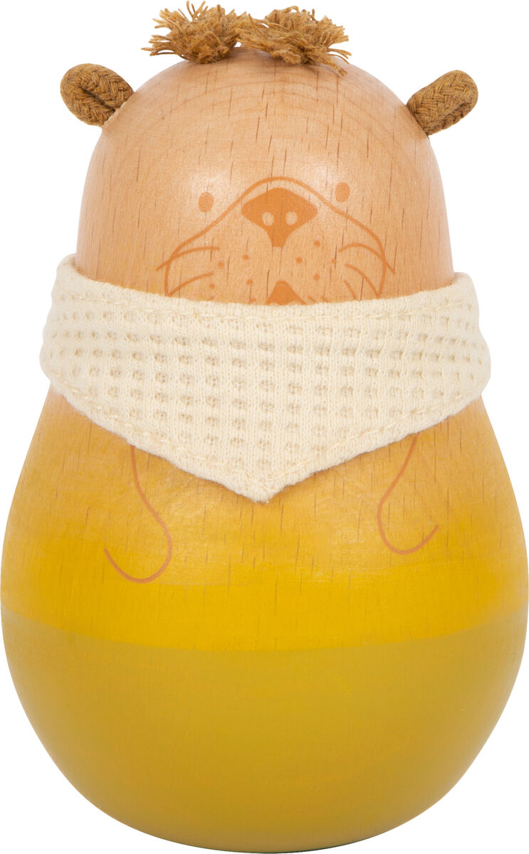 Ein Babyspielzeug in Form eines Seehundes namens 'Seaside'. Das Holzspielzeug hat einen beigen Körper und eine weiße Stoffbandana um den Hals. Der untere Teil ist in Gelb gehalten.