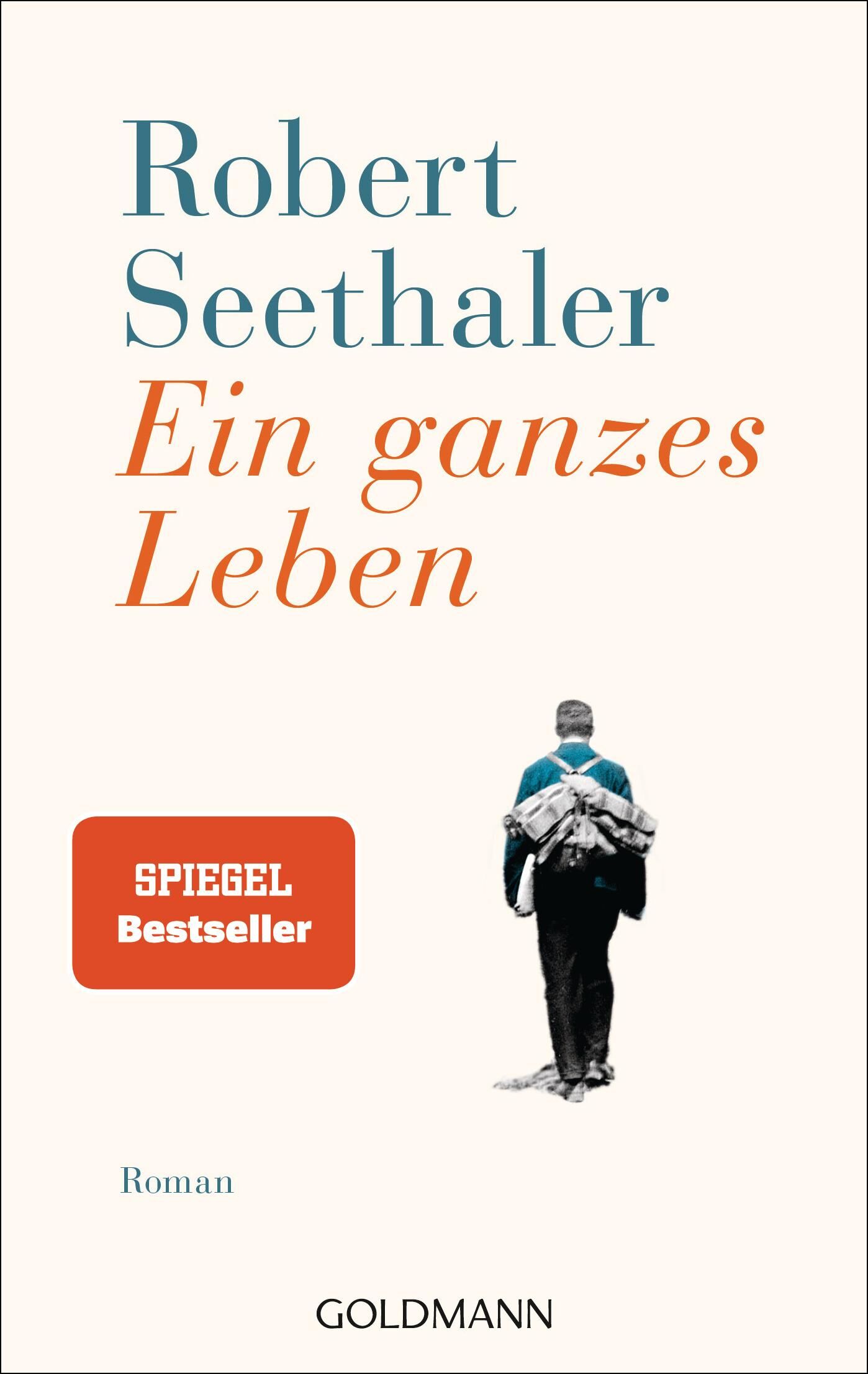 Buchcover von 'Ein ganzes Leben' von Robert Seethaler, Veröffentlichung von Goldmann Verlag. Das Cover zeigt einen Mann, der einen Berg hinaufgeht, mit Texten in Blau und Orange.