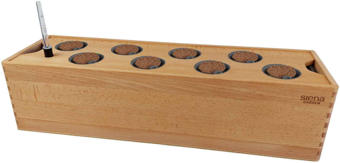 Bild einer Hydroponik-Box aus Holz mit acht Einzelfächern für Pflanzenkulturen, inklusive eines kleinen Metallstabes zur Wasserstandsanzeige.