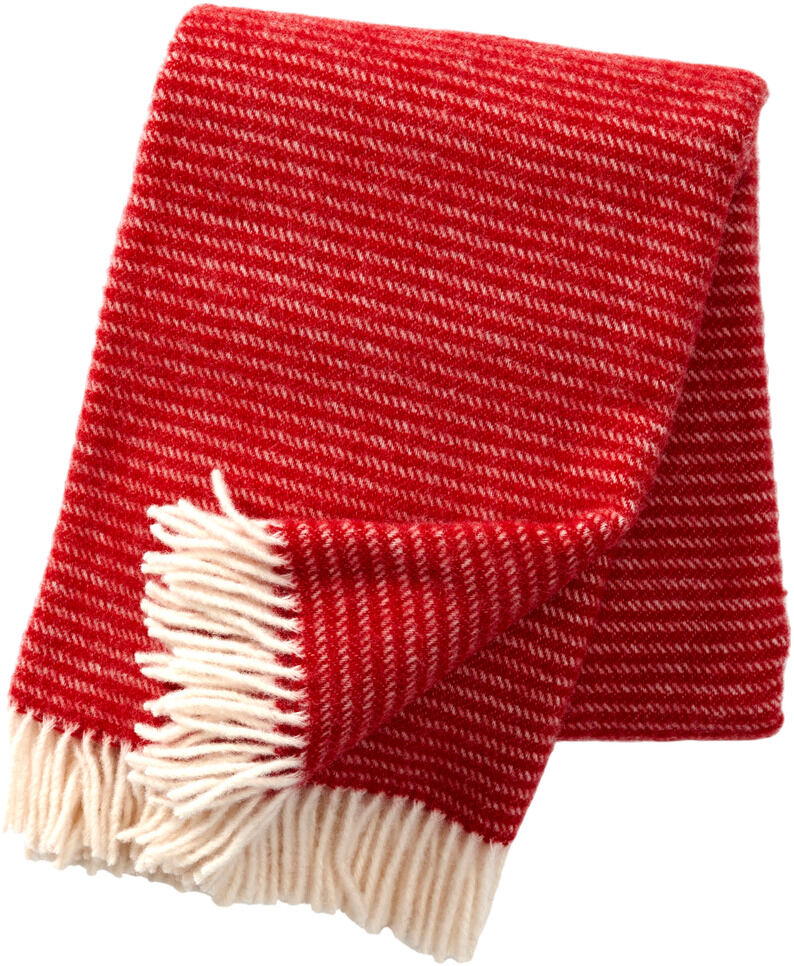 Eine rot-weiß gestreifte Decke namens 'Ralph' mit Fransen an den Enden, ideal für gemütliche Winterabende und weihnachtliche Dekoration.