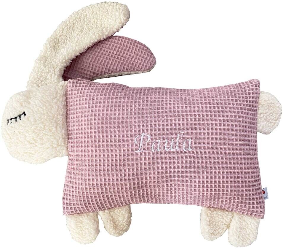 Ein weiches Kuscheltierkissen in Form eines Hasen. Der Körper des Kissens ist rosa gefärbt, während die Ohren und Beine weiß und flauschig sind. Perfekt für Kinder zum Kuscheln und als dekoratives Element im Kinderzimmer.