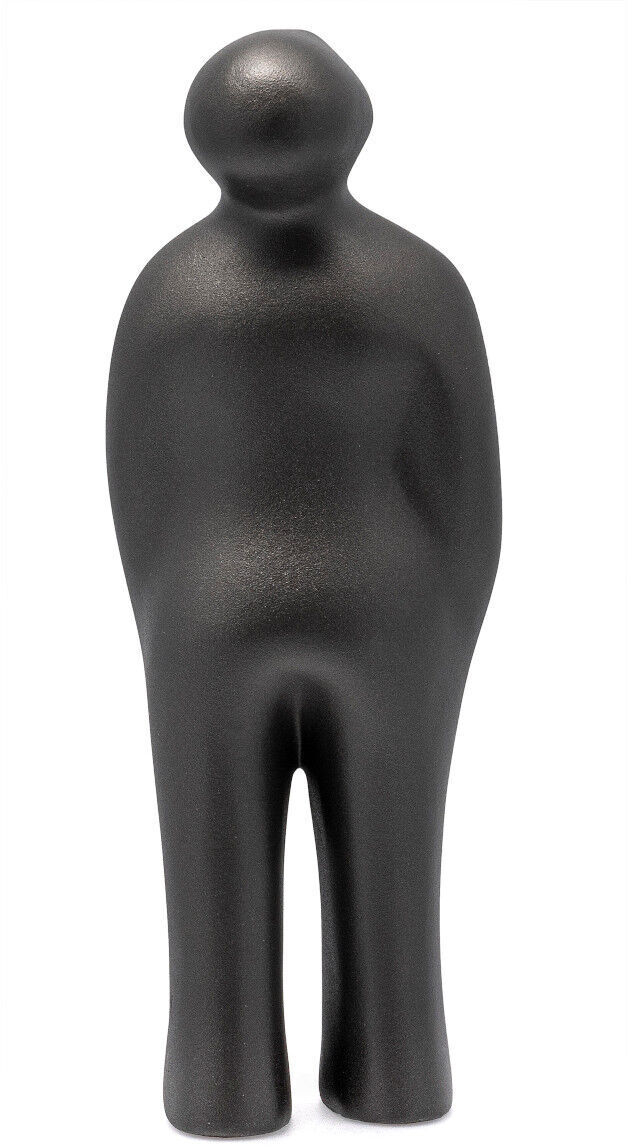 Eine moderne, abstrakte Skulptur in Schwarz, dargestellt als stilisierte menschliche Figur mit minimalistischen Formen. Die Skulptur 'The Visitor Plus' von Guido Deleu zeigt ein aufrecht stehendes Wesen mit runden, weichen Konturen.