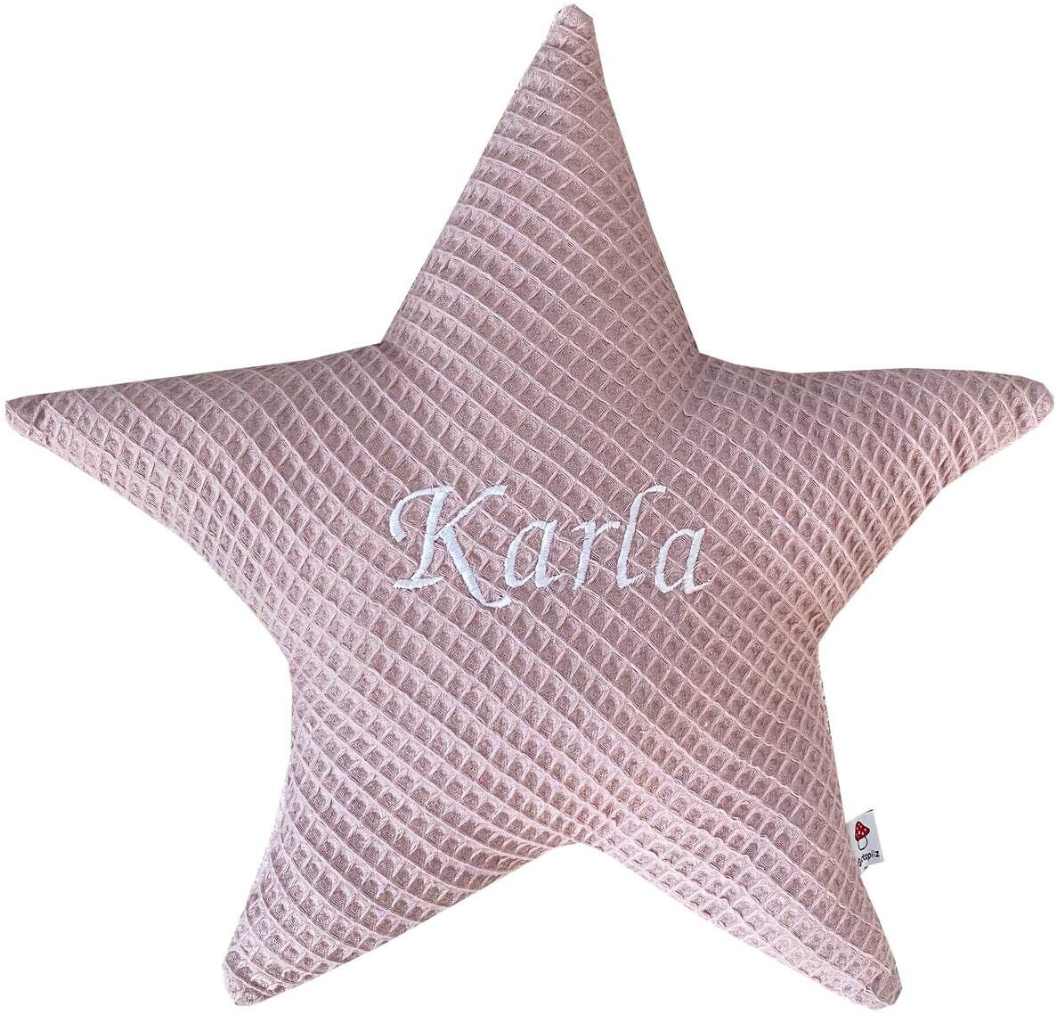 Ein personalisierbares Sternenkissen in rosa mit dem aufgestickten Namen 'Karla'.