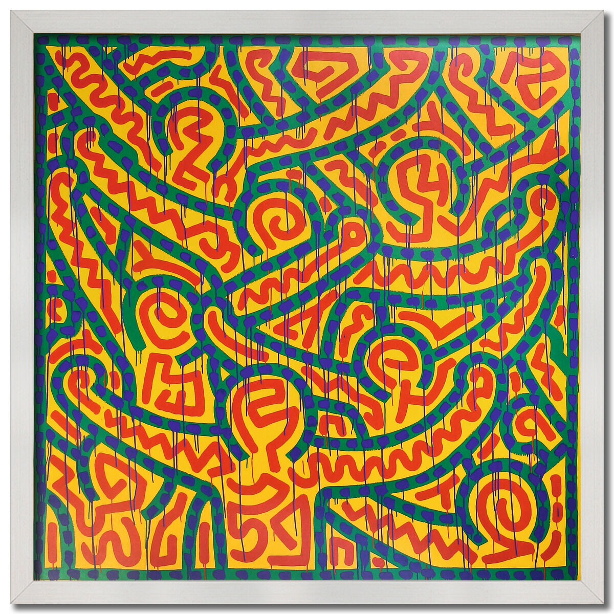 Ein gerahmtes Kunstwerk von Keith Haring mit dem Titel 'Untitled 1989'. Das Bild zeigt komplexe, farbenfrohe Muster in Gelb, Rot, Grün und Blau, typisch für Harings Stil der abstrakten und grafischen Kunst.