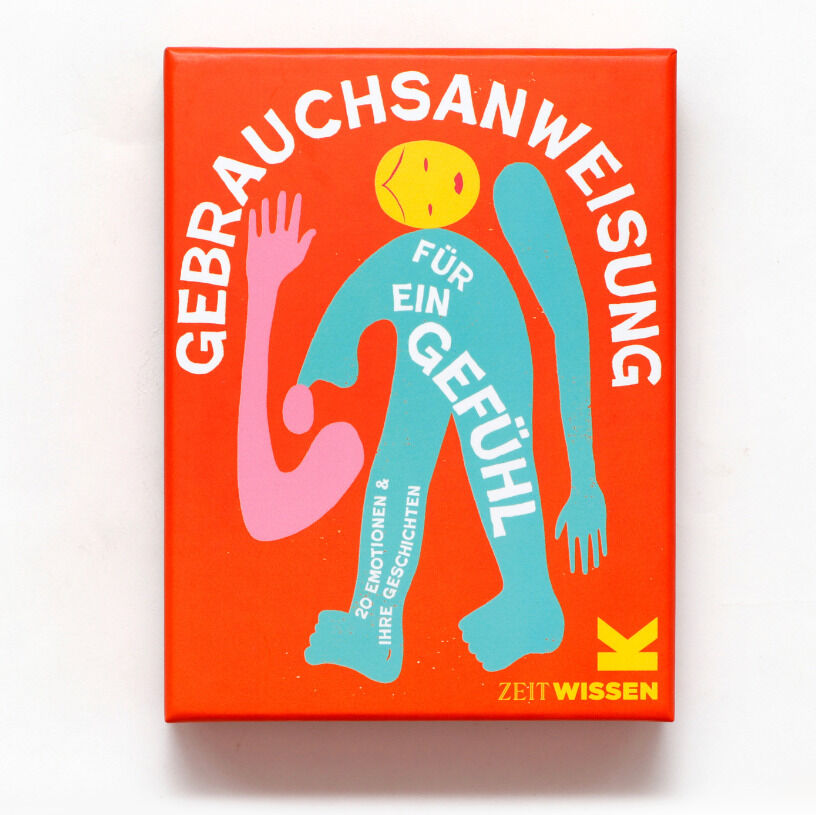 Buch mit dem Titel 'Gebrauchsanweisung für ein Gefühl' auf rotem Cover. Das Cover zeigt bunte, geschwungene Formen in Türkis, Pink, Gelb und Blau.