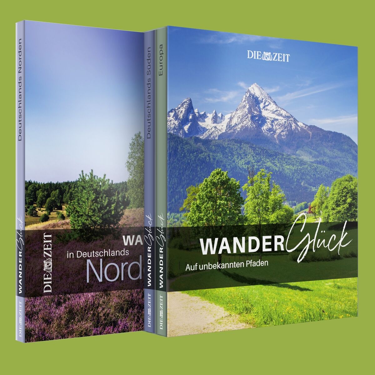 Das Bild zeigt zwei Bücher der ZEIT-Edition »WanderGlück«. Das vordere Buch hat ein Cover mit einem Berg- und Waldpanorama und trägt den Titel »WanderGlück – Auf unbekannten Pfaden«. Das zweite Buch im Hintergrund zeigt eine Heidelandschaft mit grünen Bäumen und violetten Blumen. Beide Covers tragen das ZEIT-Logo.