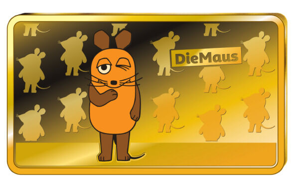 Der Goldbarren zeigt die Cartoonfigur 'Die Maus' in Orange und Braun auf einem goldenen Hintergrund mit mehreren kleineren Abbildungen der Maus und dem Schriftzug 'DieMaus'.