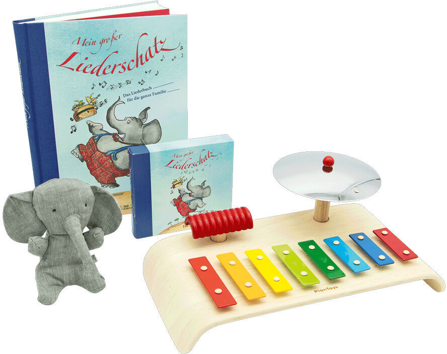 Ein Geschenkset „Musik für die Kleinen“, das ein Xylophon mit bunten Tasten, eine kleine Trommel, zwei Kinderbücher und ein graues Stofftier in Form eines Elefanten enthält.