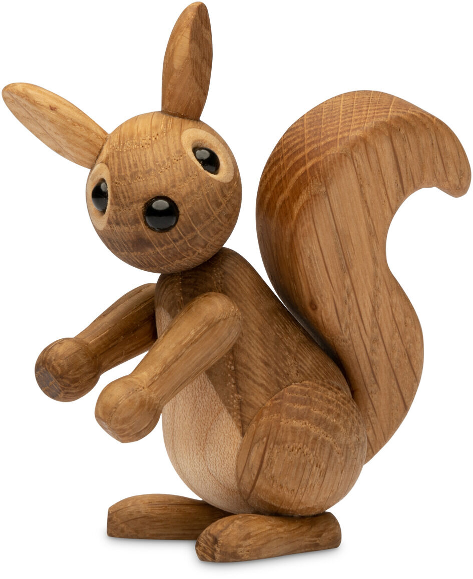 Die Figur besteht aus naturbelassenem, glattem Holz und zeigt ein stehendes Eichhörnchen. Das Design ist schlicht. Es hat schwarze Augen und eine schwarze Nase. Bauch und Augenäußeres sind helleres Holz.
