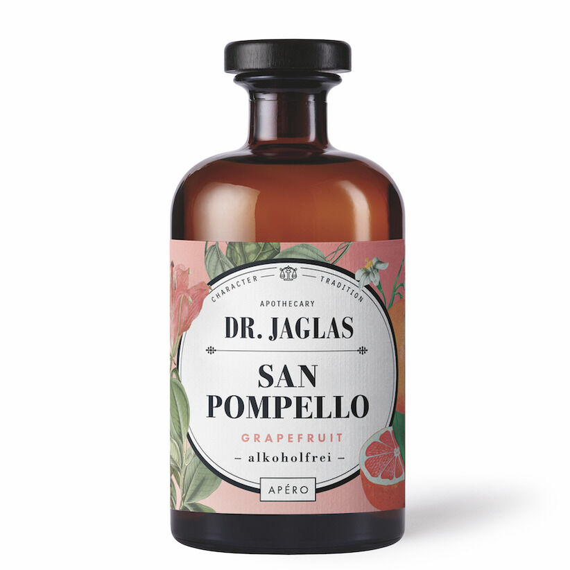 Flasche des alkoholfreien Aperitifs »San Pompello« von Dr. Jaglas mit Grapefruit-Geschmack und kunstvoll gestaltetem Etikett in Brauntönen mit rosa und grünen botanischen Elementen.
