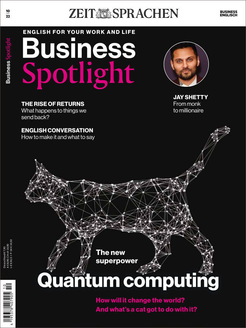 Titelbild des Business Spotlight Magazins 10/2022 mit Fokus auf Quantencomputing und Bild von Jay Shetty. Die Überschriften thematisieren Geschäftskommunikation, Technologie und Karriereentwicklung. Ein geometrisch geformter Katzenumriss ist im Vordergrund.