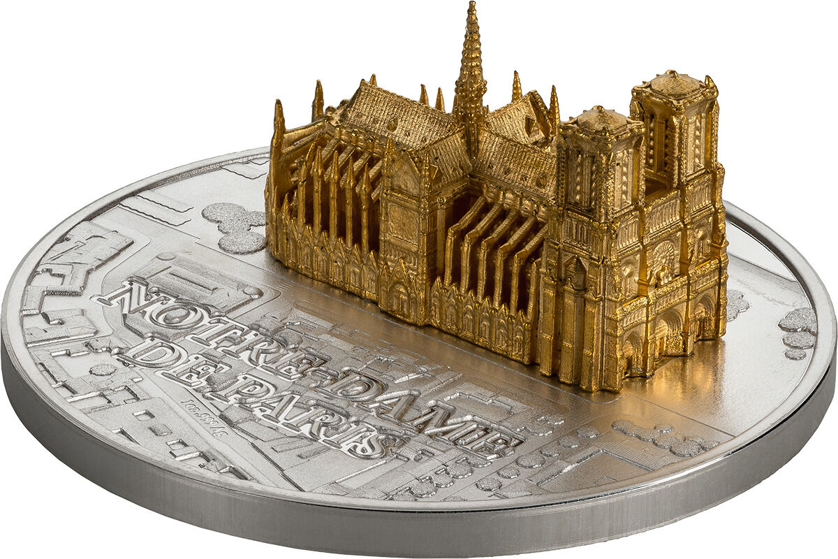 Eine 3D Skulptur-Münze mit der Darstellung der Notre-Dame de Paris in filigraner Detailarbeit. Die Skulptur zeigt die berühmte Kathedrale im Miniaturformat und ist in den Farben Gold und Silber gehalten.