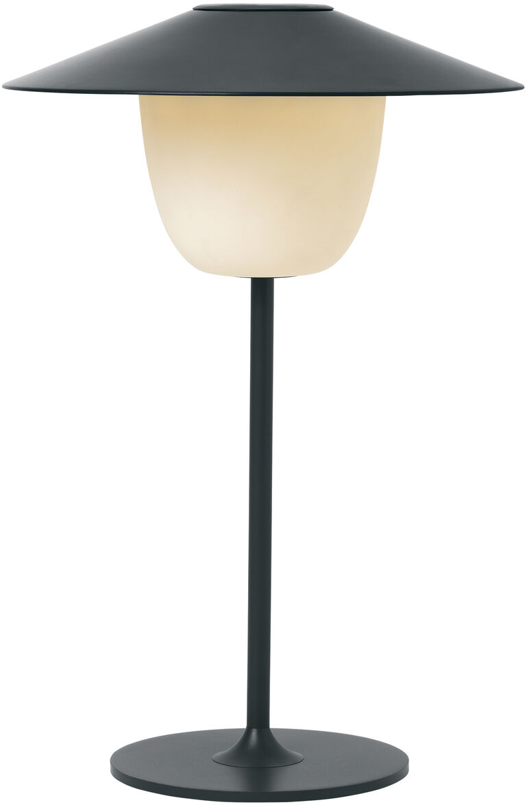 Eine mobile LED Tischleuchte namens 'ANI' mit schwarz-weißem, minimalistischem Design. Die Lampe hat eine zylinderförmige Basis und einen schalenförmigen Lampenschirm.