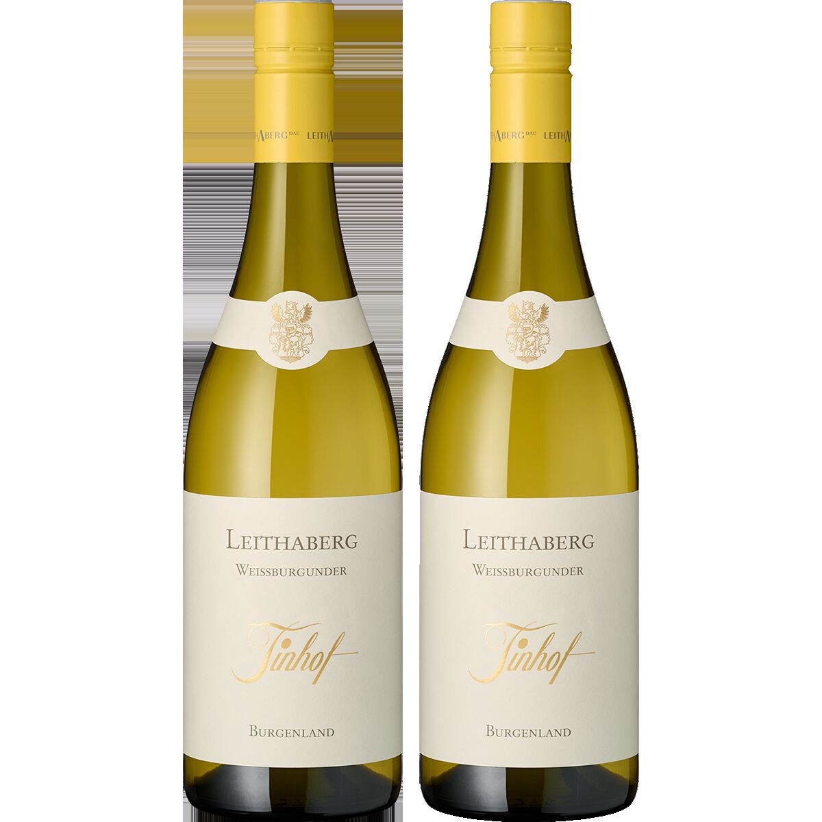 Zwei Flaschen Weißwein des Weinguts Tinhof mit heller Etikettierung und goldenem Verschluss, nebeneinander auf weißem Hintergrund platziert. Beide Flaschen sind mit dem Schriftzug 'Leithaberg Weißburgunder Tinhof Burgenland' versehen, die Aufmachung wirkt edel und hochwertig.