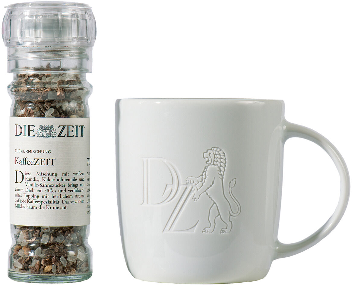 Geschenkset bestehend aus einem Glasstreuer mit Zucker- und Gewürzmischung und einer weißen Tasse mit einem geprägten Löwen-Logo.