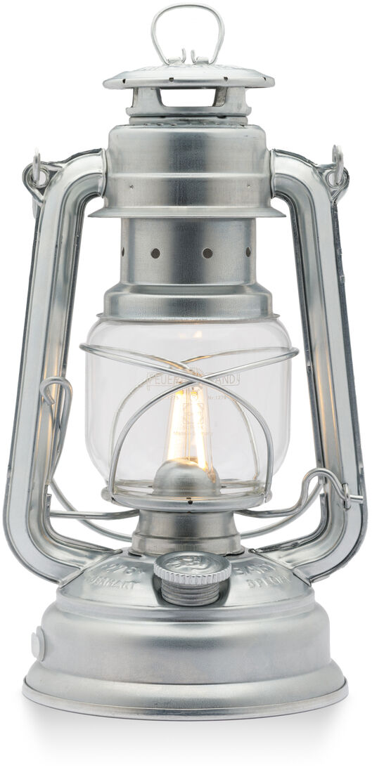LED Laterne »Baby Special 276« aus Metall und Glas in silbernem Retro-Design mit sichtbarer Glühbirne, geeignet für Camping, Outdoor und Dekorationszwecke.