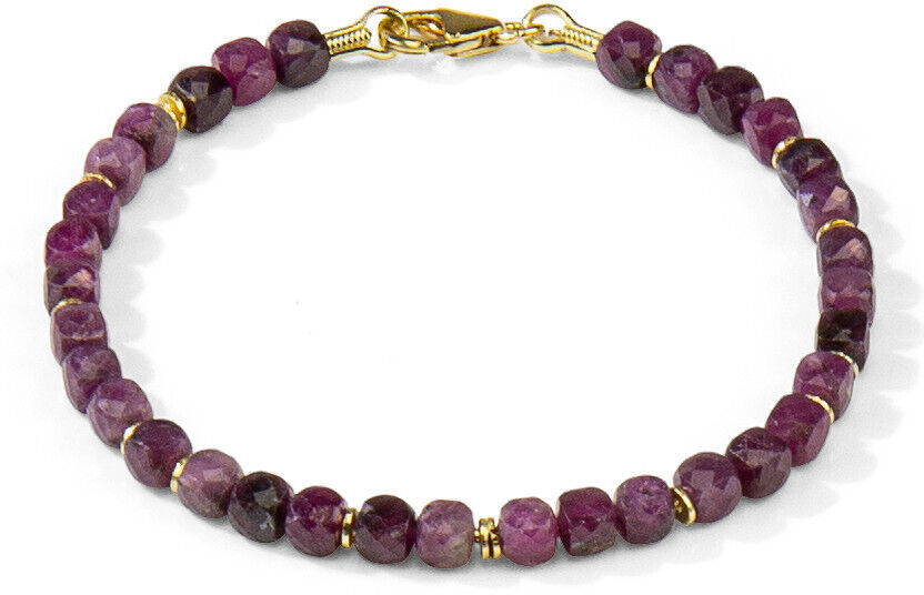 Ein elegantes Armband mit roten Edelsteinen und goldenen Akzenten, das zu einem Schmuckset namens 'Ruby Red' gehört. Geeignet für festliche Anlässe und als Geschenkidee für Damen.