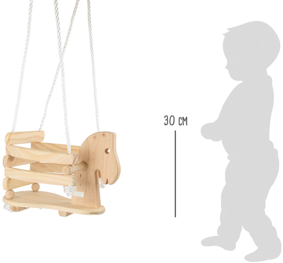 Eine Schaukel in Form eines Ponys aus Holz hängt an weißen Seilen. Daneben ist ein grauer Umriss eines Kleinkindes zu sehen, der die Größe der Schaukel mit einem Maßstab von 30 cm anzeigt.