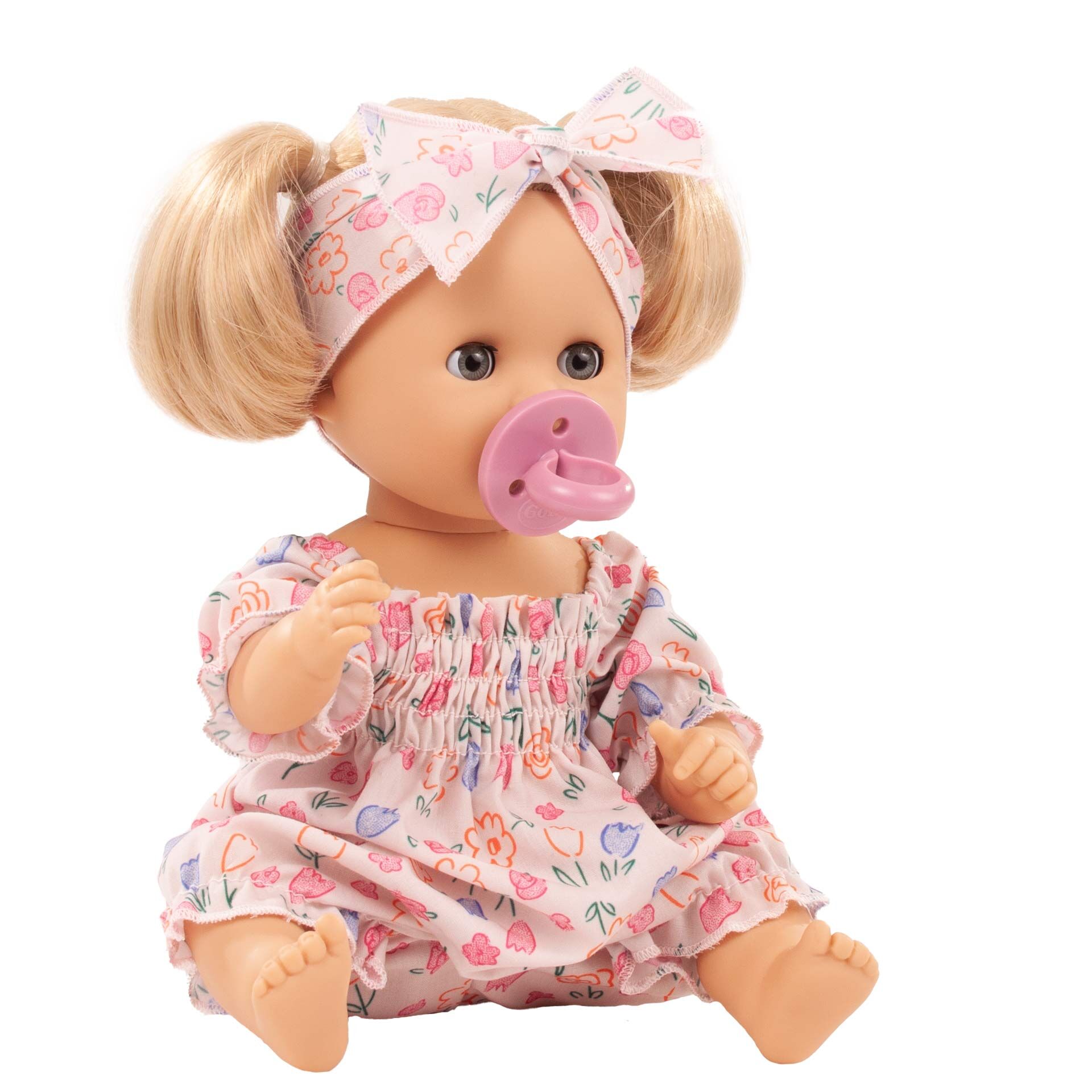 Die Badepuppe »Sleepy Aquini Girl Bliblablume« sitzt aufrecht und trägt einen rosa-weißen Schlafanzug mit buntem Blumenmuster sowie ein dazu passendes Stirnband. Sie hält einen Schnuller im Mund und hat einen freundlichen Gesichtsausdruck. Das Produkt ist speziell für Kinder zum Spielen, Kuscheln und Baden geeignet.