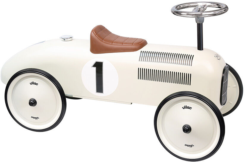 Weißes Vintage-Spielzeugauto mit der Nummer eins an der Seite, ausgestattet mit einem braunen Sitz und schwarzem Lenkrad. Ideal für Kinder.