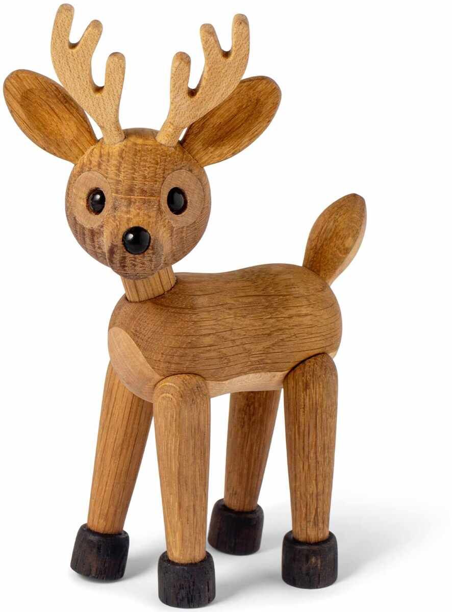 Auf dem Bild ist eine dekorative Holzfigur in Form eines Rehs zu sehen. Die Figur besteht aus naturfarbenem und dunkelbraunem Holz und wirkt freundlich. Sie ist freistehend und besitzt große Ohren sowie ein Geweih. Die Holzfigur eignet sich gut als Dekoration, Geschenk oder Spielzeug für Kinder und Erwachsene.