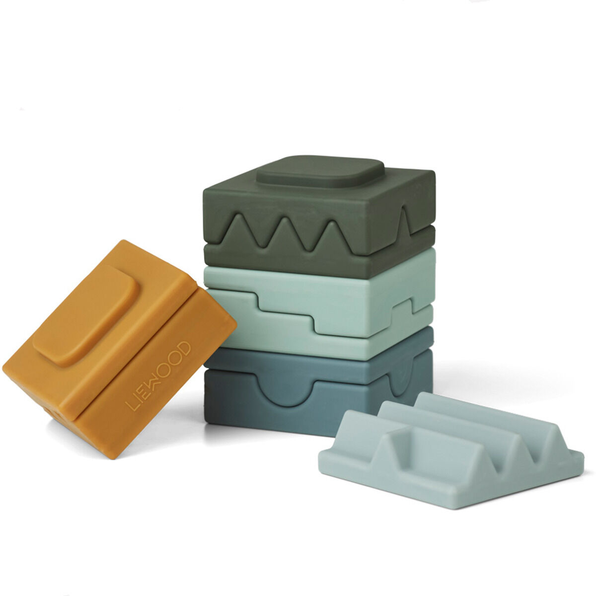 Das Bild zeigt einen Stapelturm aus verschiedenen Silikonblöcken in Blau-, Grün-, Grau- und Gelbtönen. Die Blöcke haben unterschiedliche Formen und Texturen.