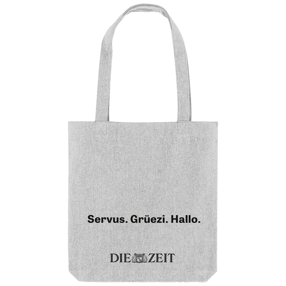 Hellgraue Stofftasche mit schwarzen Henkeln. Mittig auf der Tasche steht der Text 'Servus. Grüezi. Hallo.' in schwarzer Schrift. Darunter befindet sich das Logo der Zeitung DIE ZEIT. Die Tasche steht auf einem weißen Hintergrund, ist leer und gut sichtbar von vorne fotografiert.