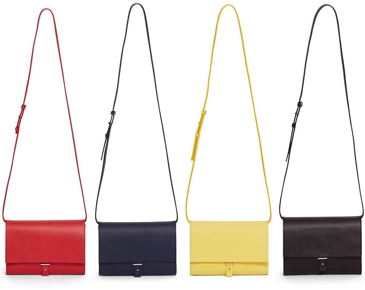 ZEIT-Sonderedition Schultertasche »DIE ZEIT 2« in vier Farben: Rot, Schwarz, Gelb und Blau, aus Leder mit langem Schulterriemen und minimalistischem Design.