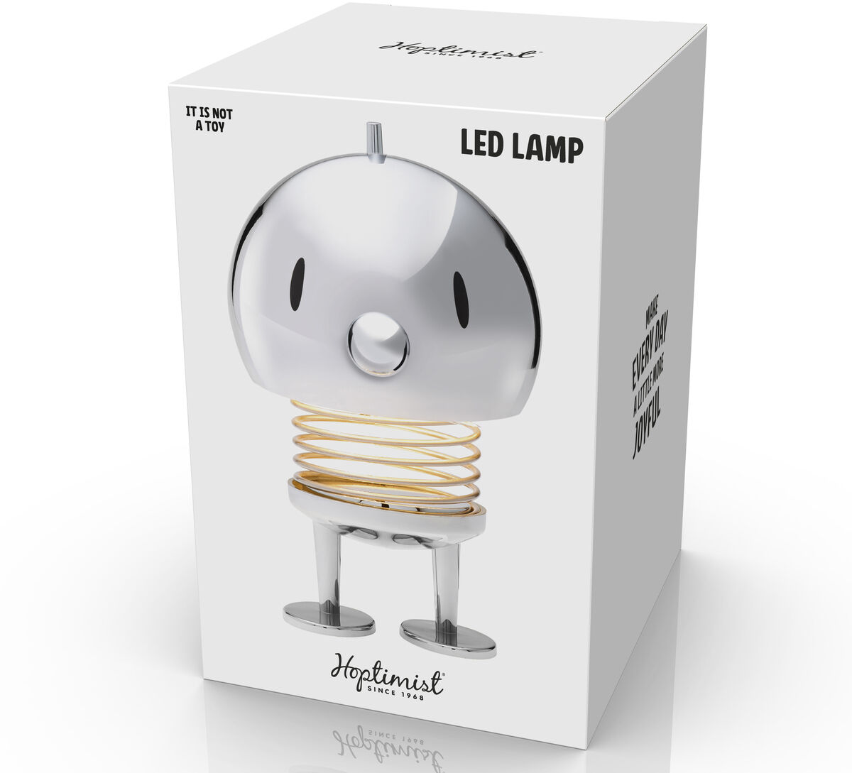 Die Hoptimist LED Lampe in Chrom ist in einer weißen Verpackung zu sehen. Sie hat eine metallische, glänzende Oberfläche und steht auf einem spiralförmigen Standfuß.