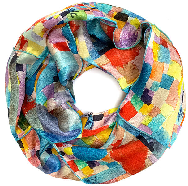 Ein farbenfroher Loopschal mit einem abstrakten Muster in Blau, Rot, Gelb, Grün, Lila und Orange, inspiriert von Paul Klees Kunstwerk 'Südliche Gärten'.