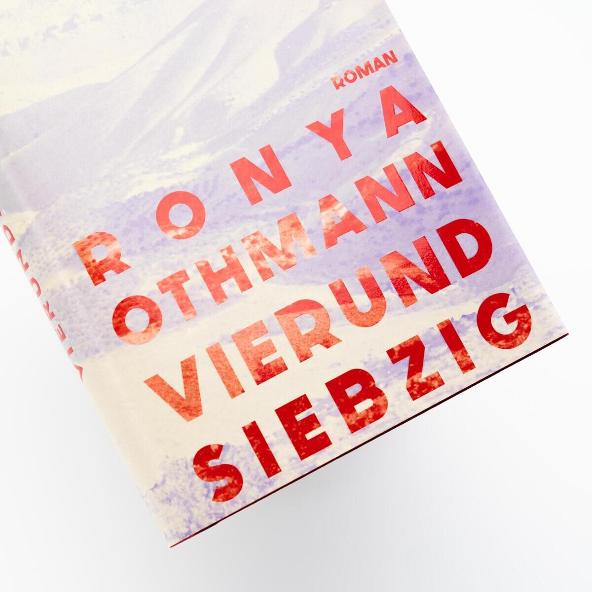 Buchcover von 'Vierundsiebzig' von Ronya Othmann, mit großem Titel in roten Buchstaben auf weißem Hintergrund.