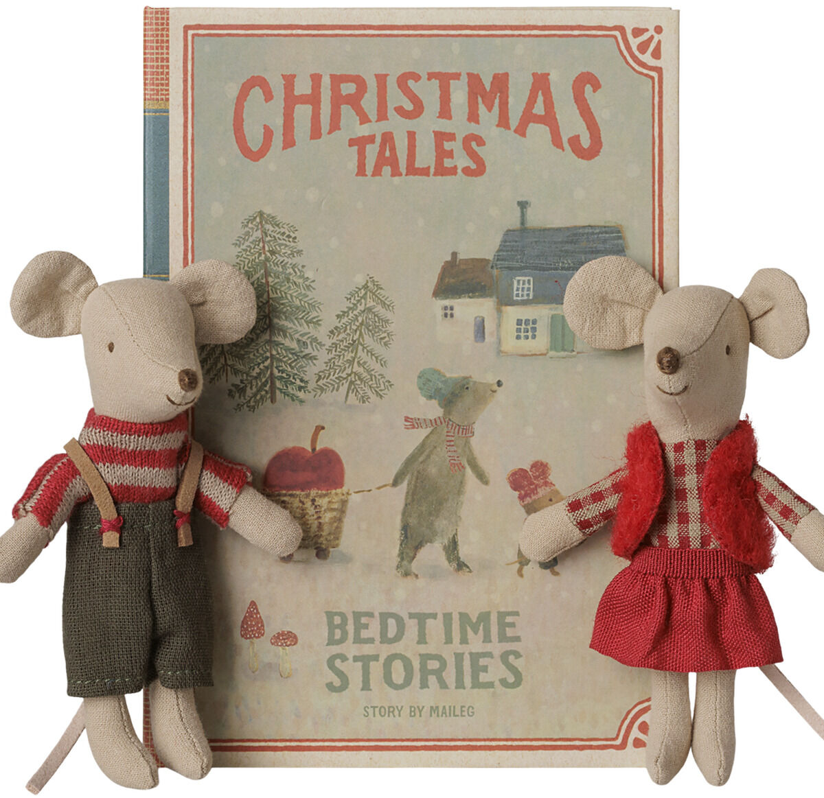 Zwei Plüschmäuse im Retro-Look, bekleidet mit karierten und roten Outfits, sitzen vor einem illustrierten Buch mit dem Titel "Christmas Tales - Bedtime Stories". Das Buch zeigt ein winterliches Hausmotiv und ist im nostalgischen Stil gestaltet.
