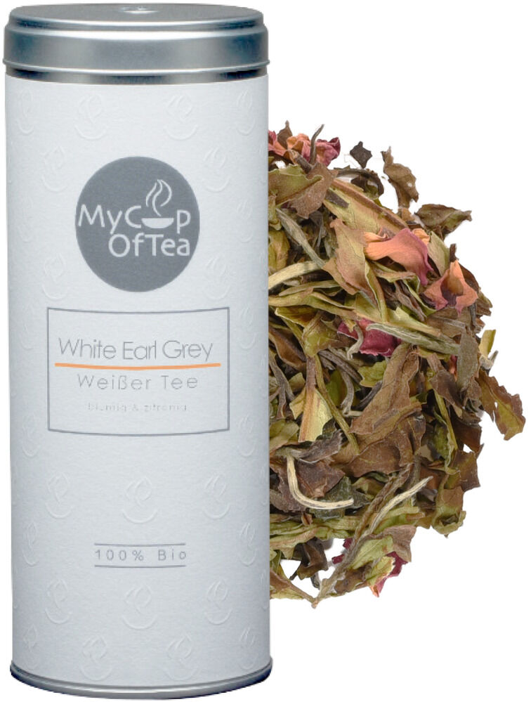 Ein Tee-Set »Earl Grey« mit einer silbernen Dose mit weißem Etikett und losen Teeblättern daneben. Perfekt für Teeliebhaber und als Geschenkidee. Biologischer, aromatischer weißer Tee.
